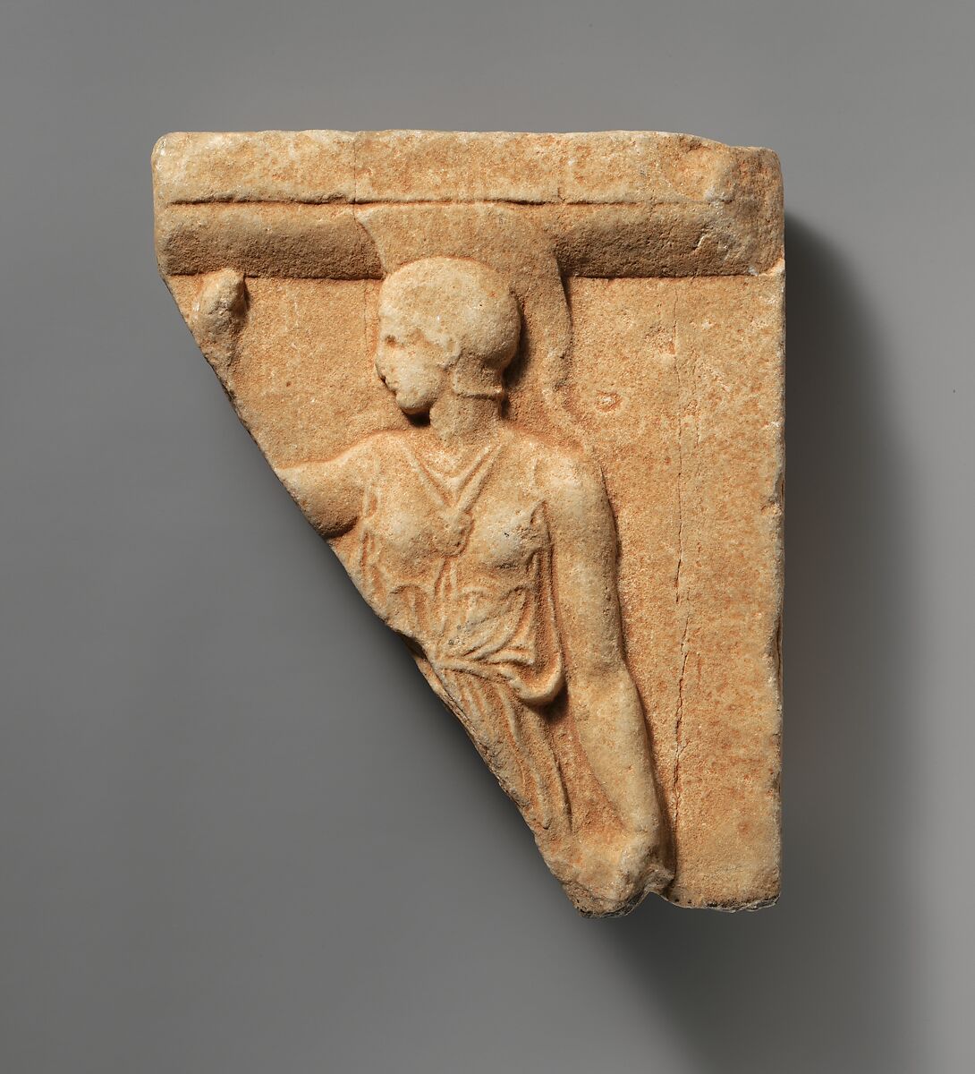 Ancient marble relief fragment showing helmeted Athena with an aegis across her chest