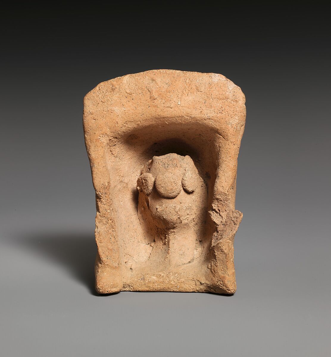 Ancient Cypriot terracotta shrine model with a sacred pillar.