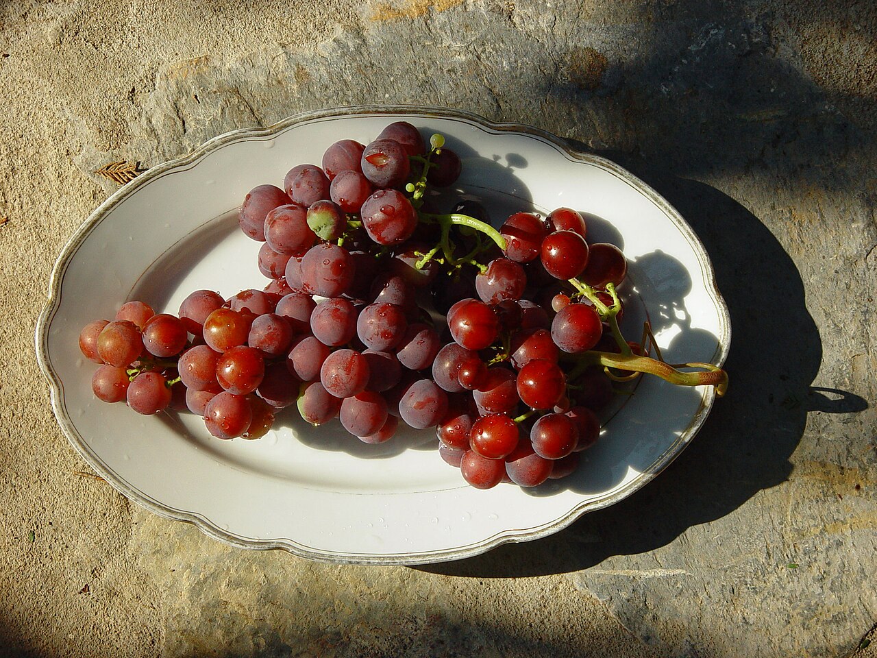 A rich cluster of red grapes