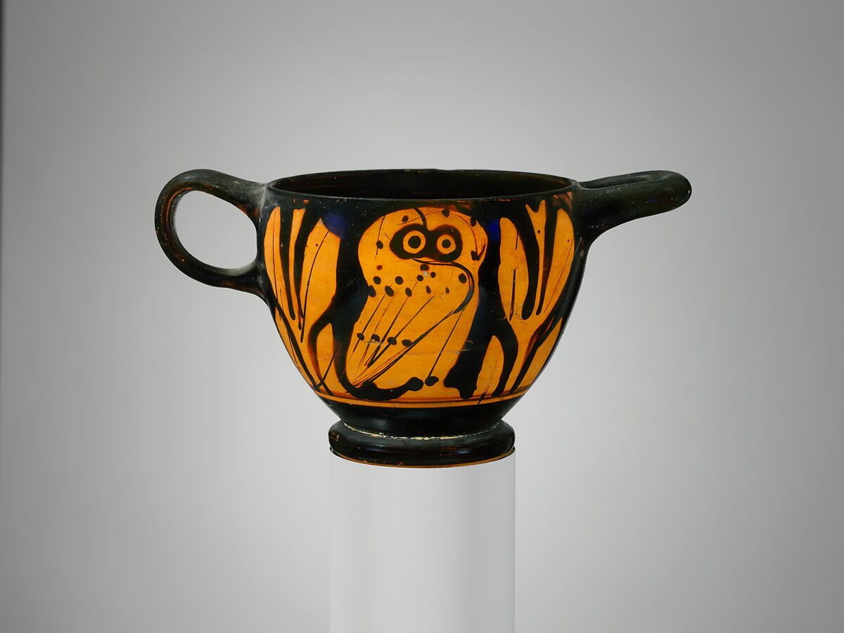 Attic terracotta drinking cup decorated with an owl between olive sprigs.