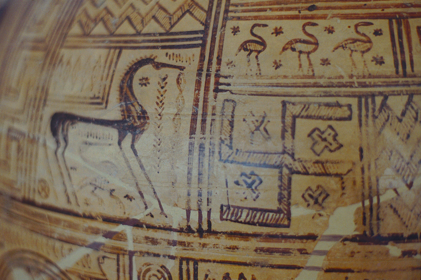 Detail of Greek Geometric pottery with a horse, waterbirds and a swastika motif