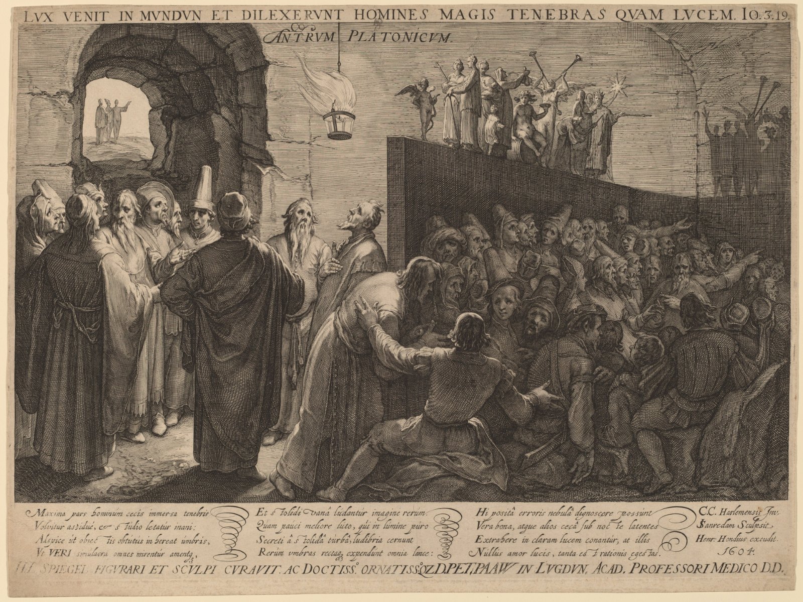 An engraving of a vast crowded cave: figures gather before a wall lit by a fire and gesture at the shadows thrown upon it, while light enters from an opening above.
