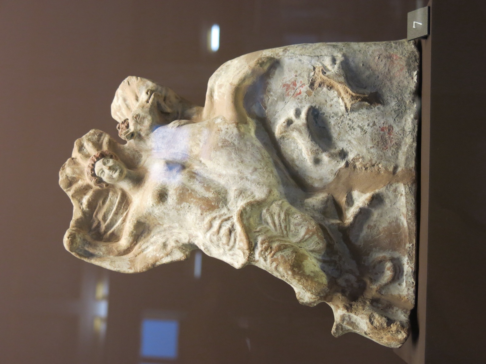 Aphrodite Pandemos ('belonging to the people') or Epitragia ('riding a billy goat')