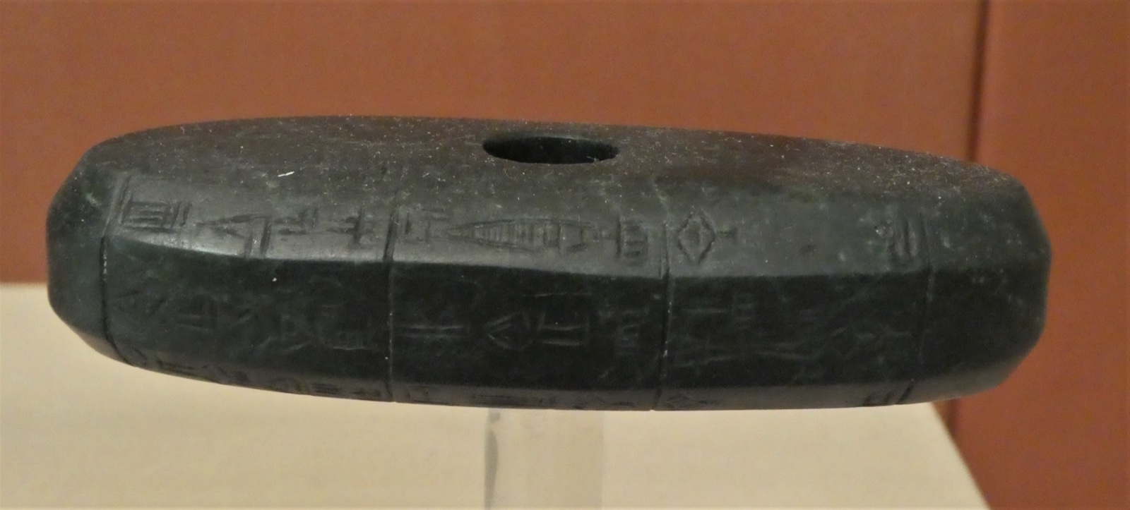 Green marble mace head with an inscription dedicating it to the god Nergal, offered by a man named Labashum on behalf of Shu-Turul, the last king of the Akkadian Empire (c