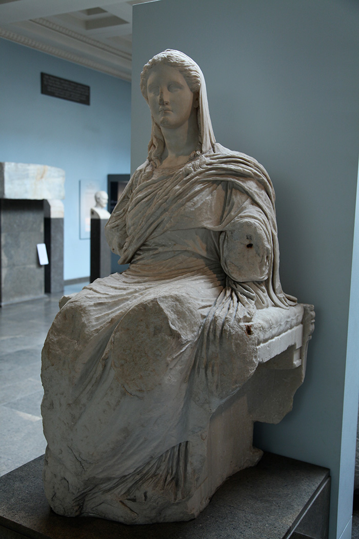 A seated marble statue of Demeter, veiled