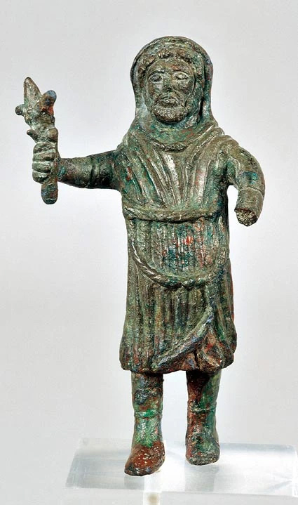 A Gallo-Roman bronze statuette of a hooded, bearded God
