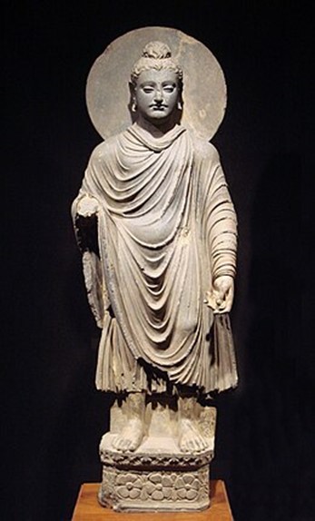 A standing Buddha with a halo, included in the Temple’s comparison of radiant sacred figures.