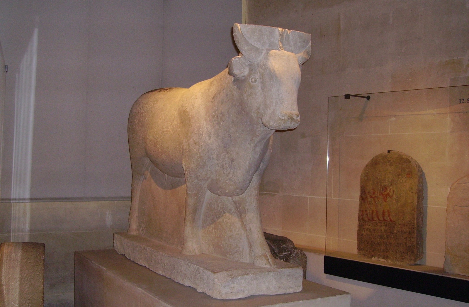 Limestone statue of the sacred Apis bull from the Serapeum of Saqqara, in the Louvre.