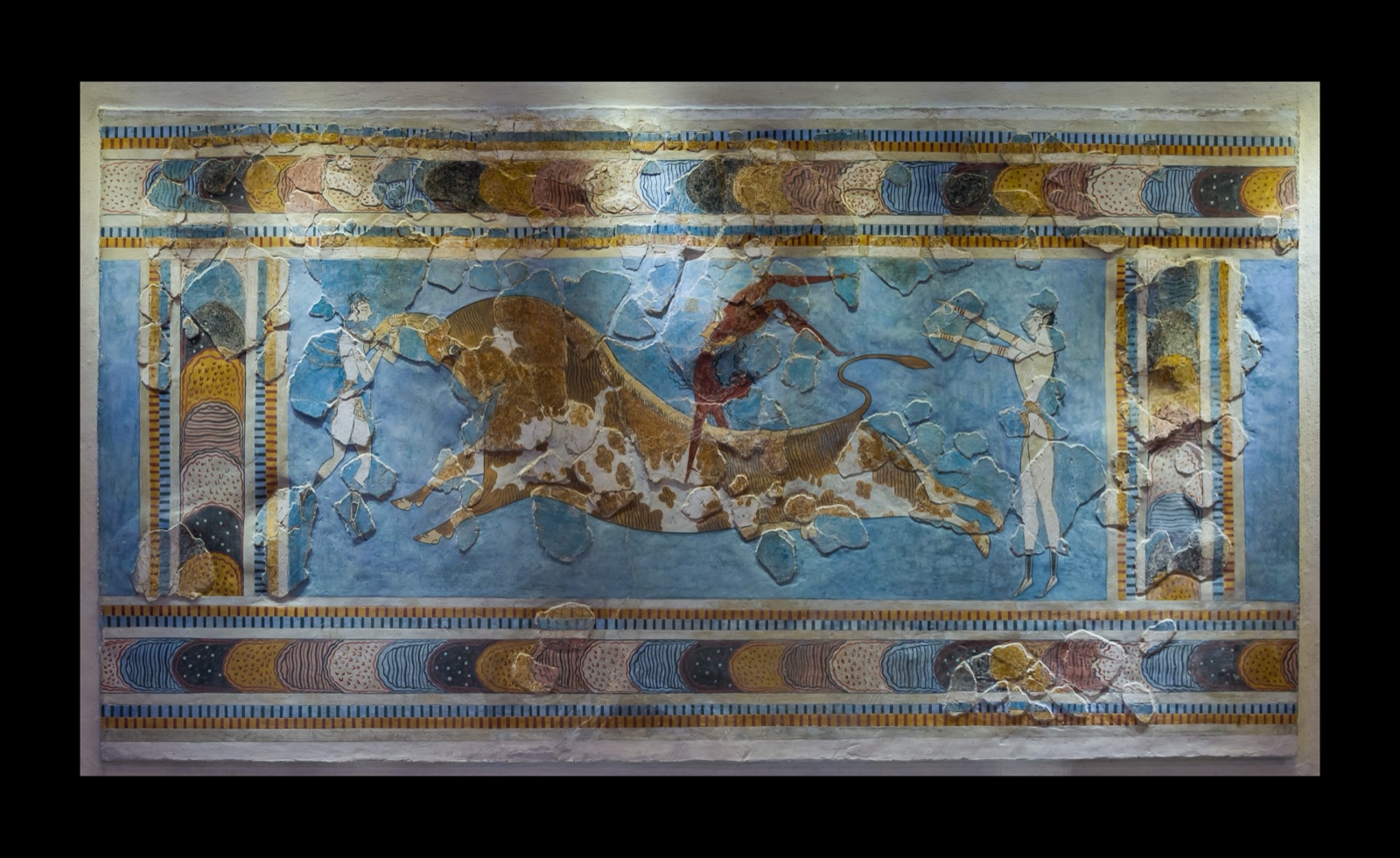 Minoan fresco of athletes leaping over a charging bull, from Knossos.