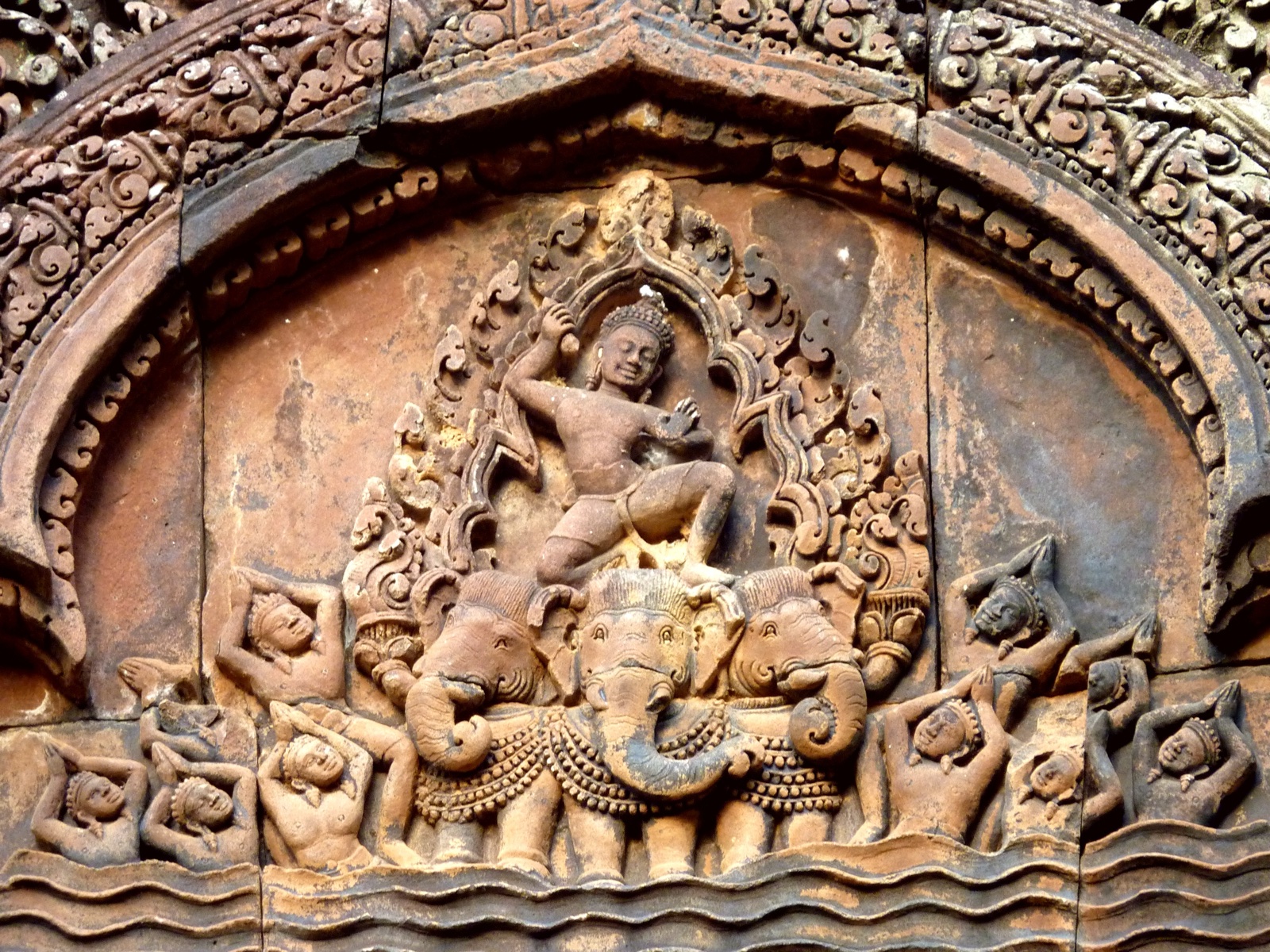 Stone relief of the God Indra seated on His elephant Airavata.