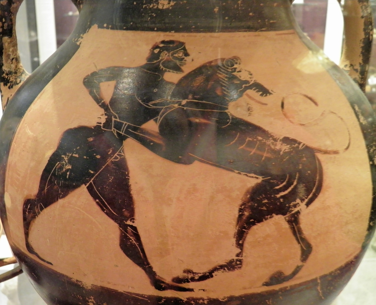 Black-figure vase painting of Heracles wrestling the Nemean lion.