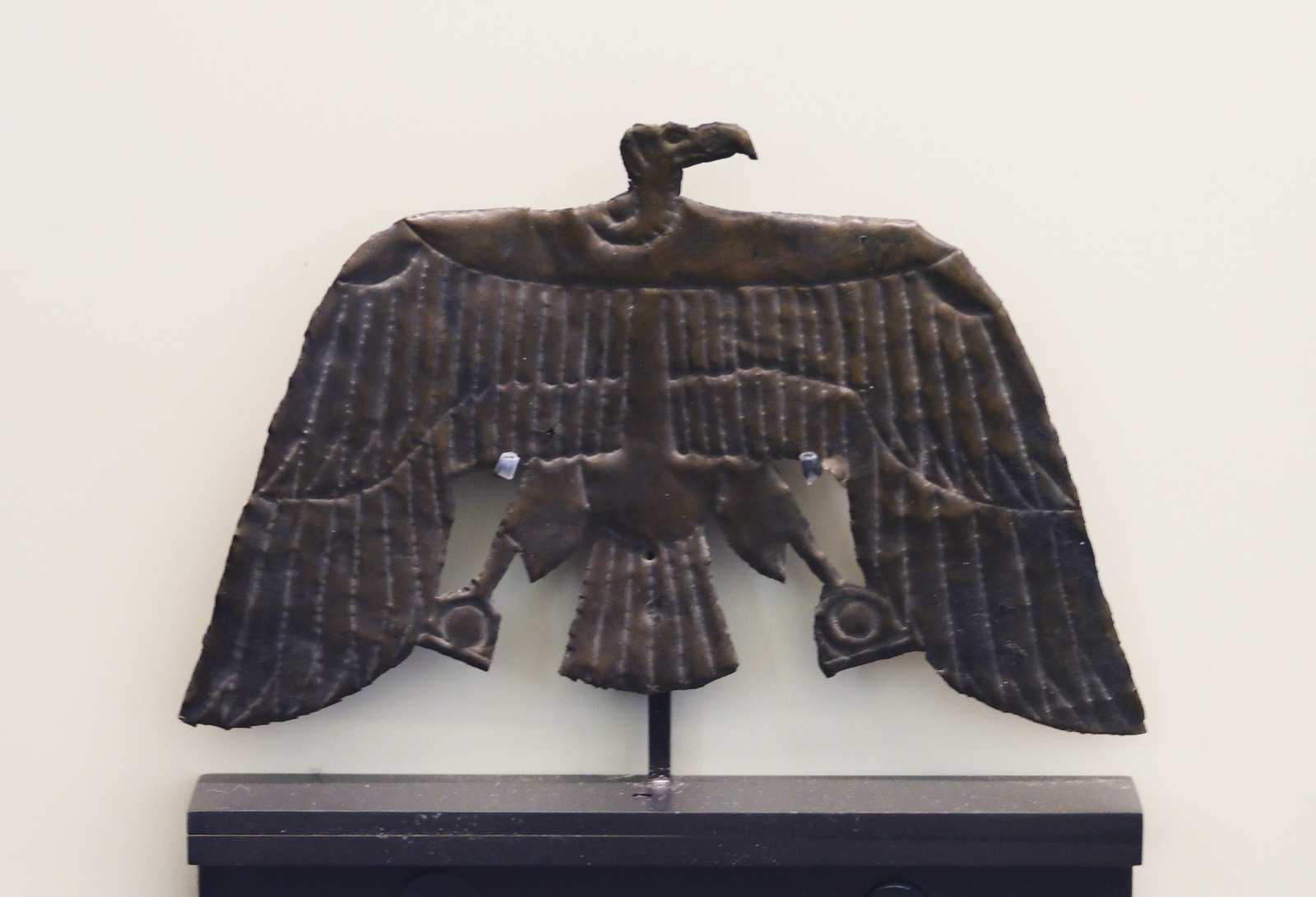 Ancient Egyptian figure of a vulture, identified as the Goddess Nekhbet, in the Louvre.