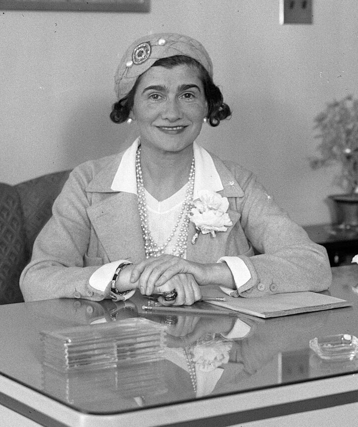 Coco Chanel at a desk during her visit to Los Angeles, 18 March 1931
