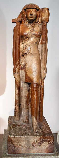 Ancient statue of Khaemwaset with sacred standards, around 1260 BCE, British Museum EA947. Photograph by Szilas, 2010