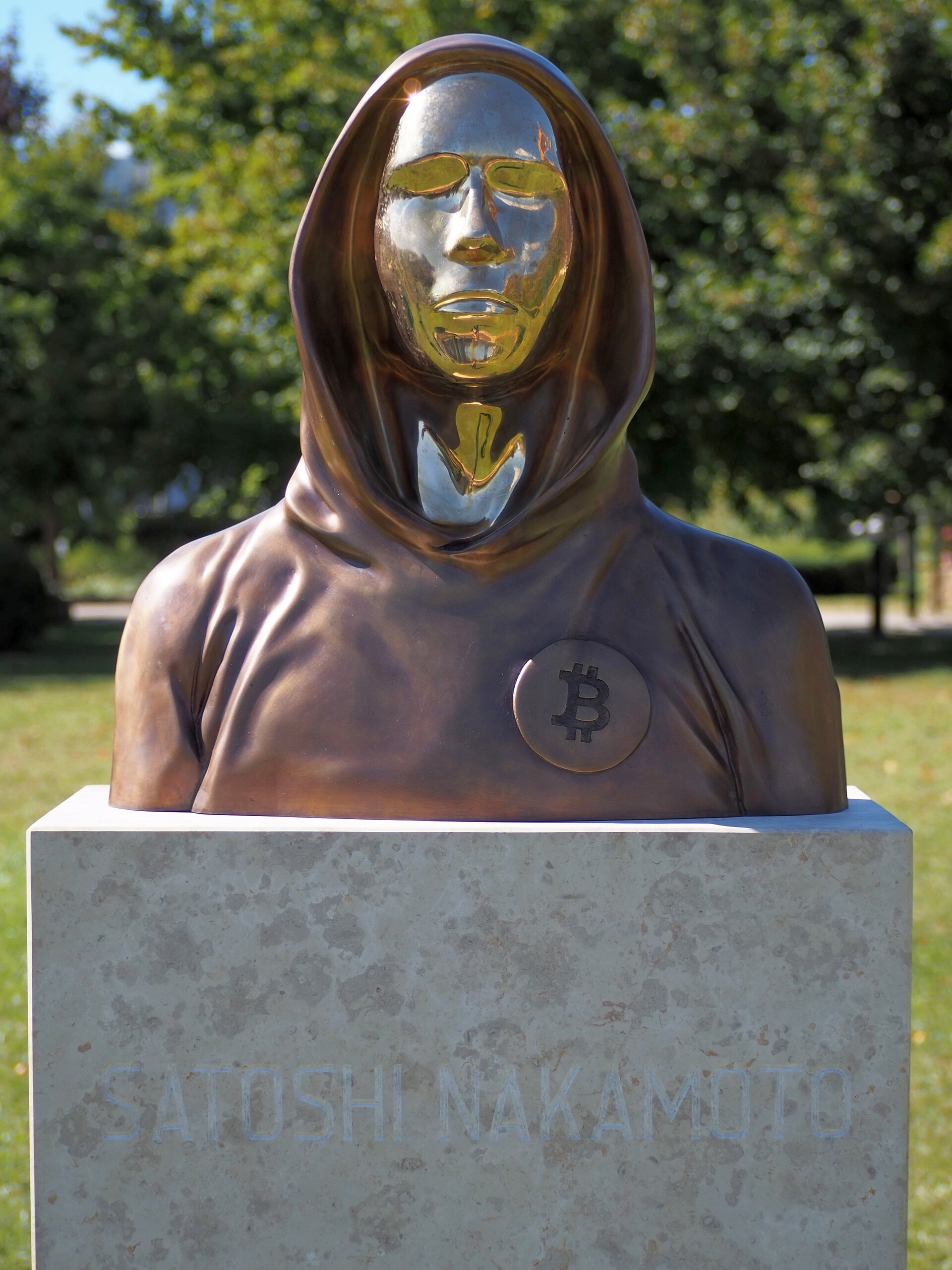 Bust of Satoshi Nakamoto by Tamás Gilly and Réka Gergely, bronze and aluminium alloy, inaugurated 16 September 2021 in Graphisoft Park, Budapest; its mirror face lets the viewer see themselves in it