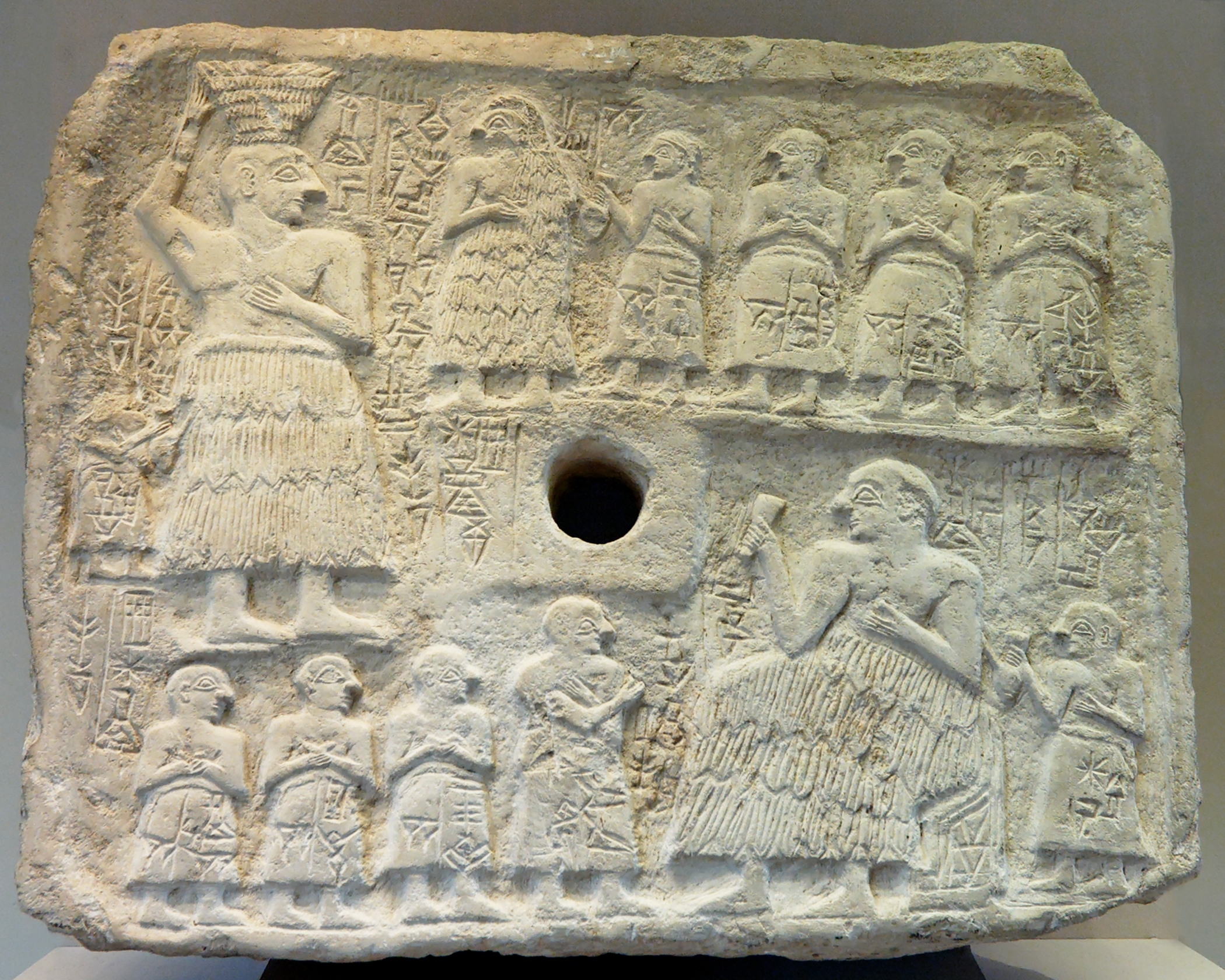 Votive relief of Ur-Nanshe, Louvre AO 2344, c. 2500 BCE. Ancient representation of temple building and a cultic banquet
